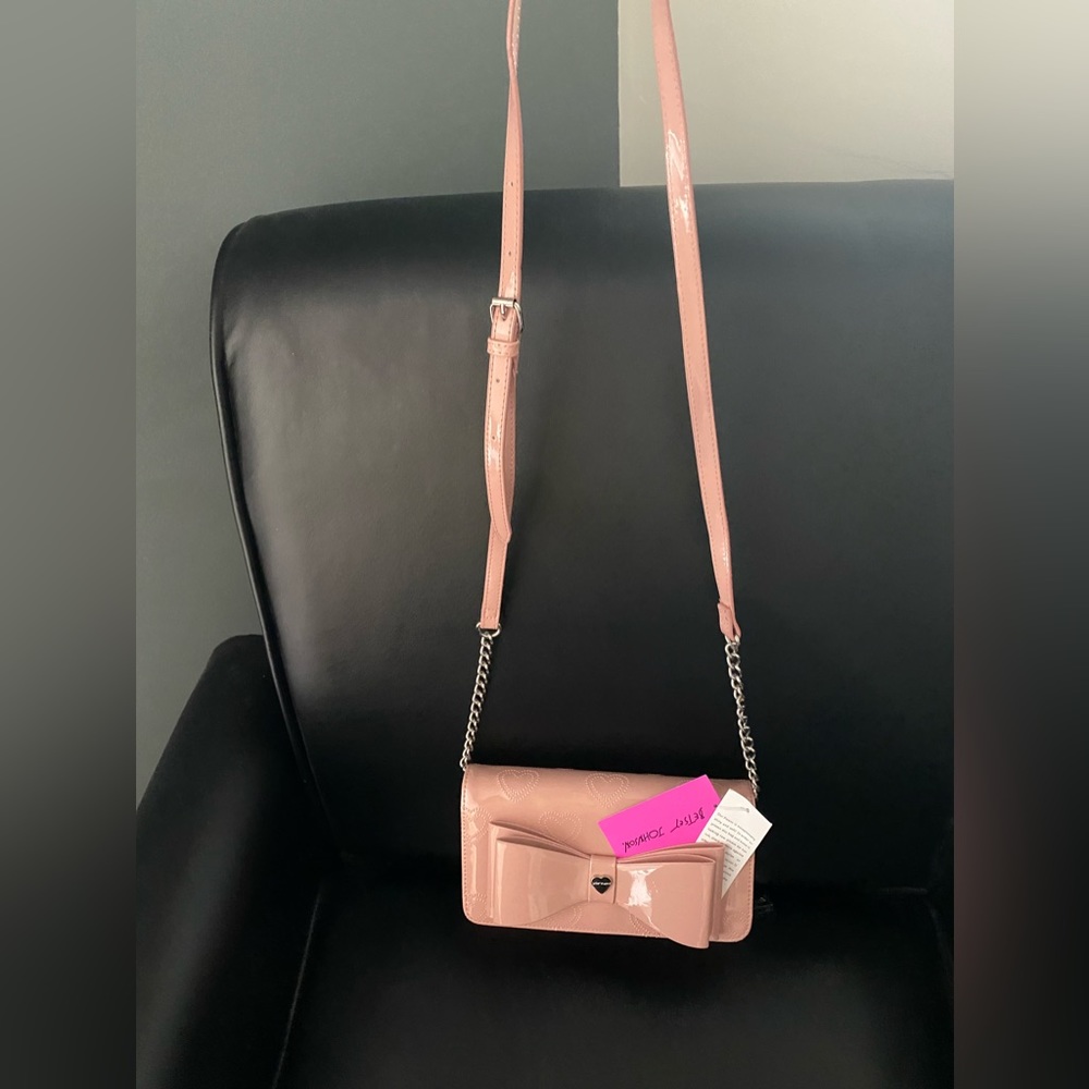 Authentic NWT Betsey Johnson crossbody light pink bag with built in wallet.